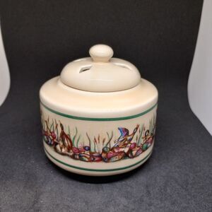 Artistic Cream Ceramic Jar with Colorful Accents